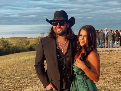 Koe Wetzel is wearing a cowboy hat with shades on whereas, Bailey Fisher is on a green dress.